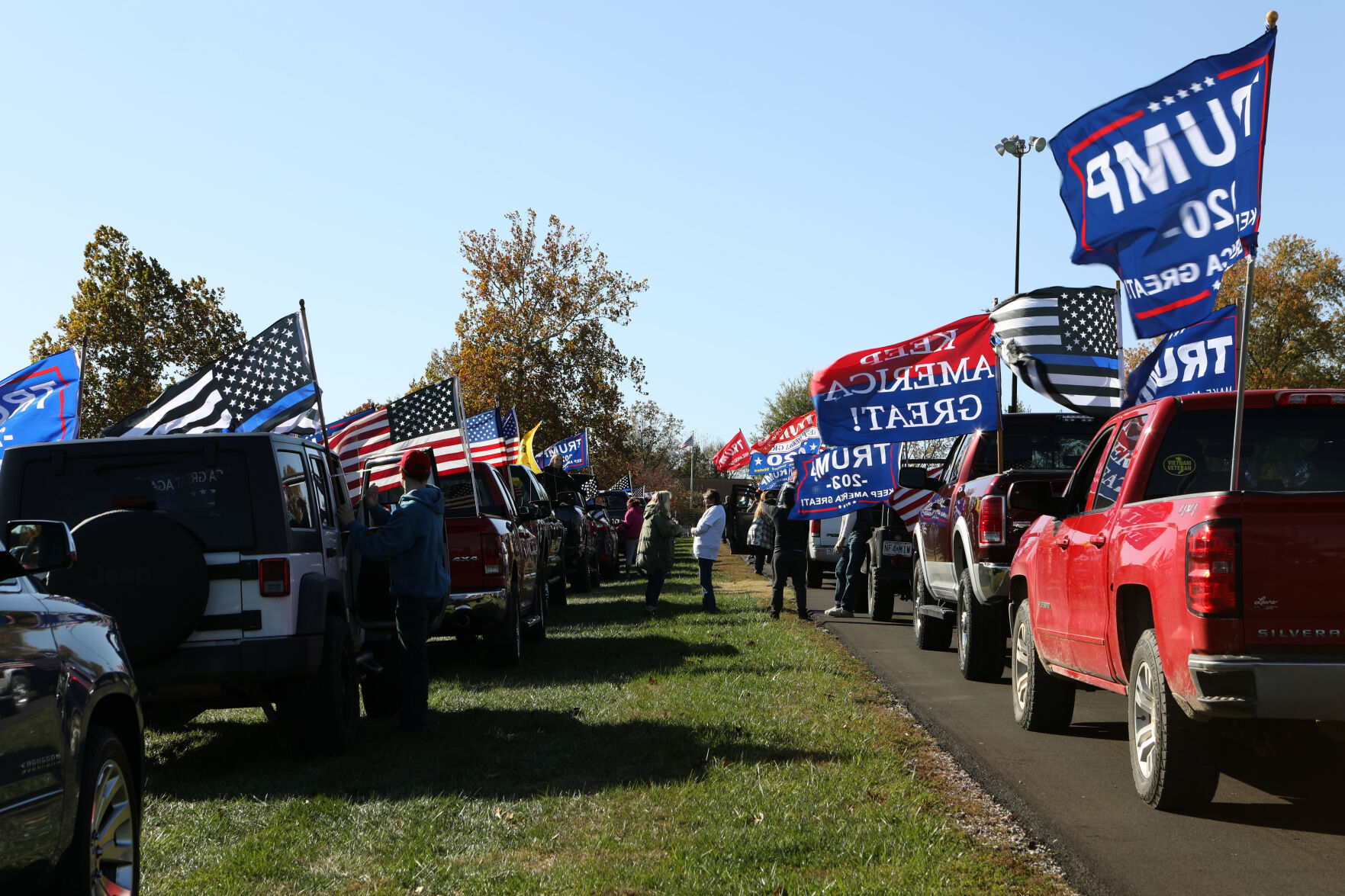 Flags fly high before "Trump Train" parade